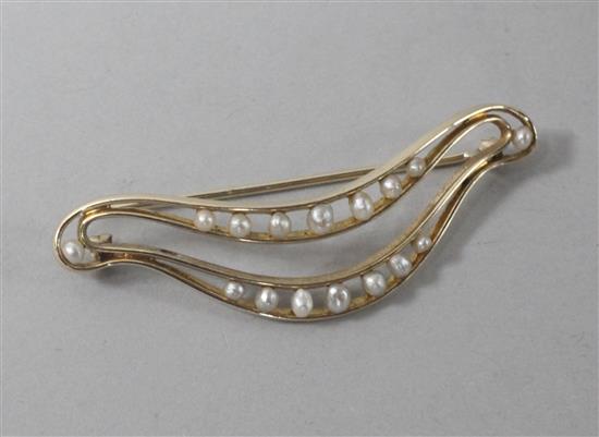 A 14ct gold and cultured pearl set brooch, 56mm.